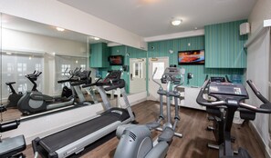 A gym with treadmills, elliptical machines, and a mirrored wall. - Holiday Inn Express & Suites Grande Prairie by IHG (Grande Prairie)