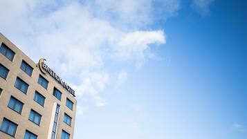A multi-story building with a sign reading "Bastion Hotel."