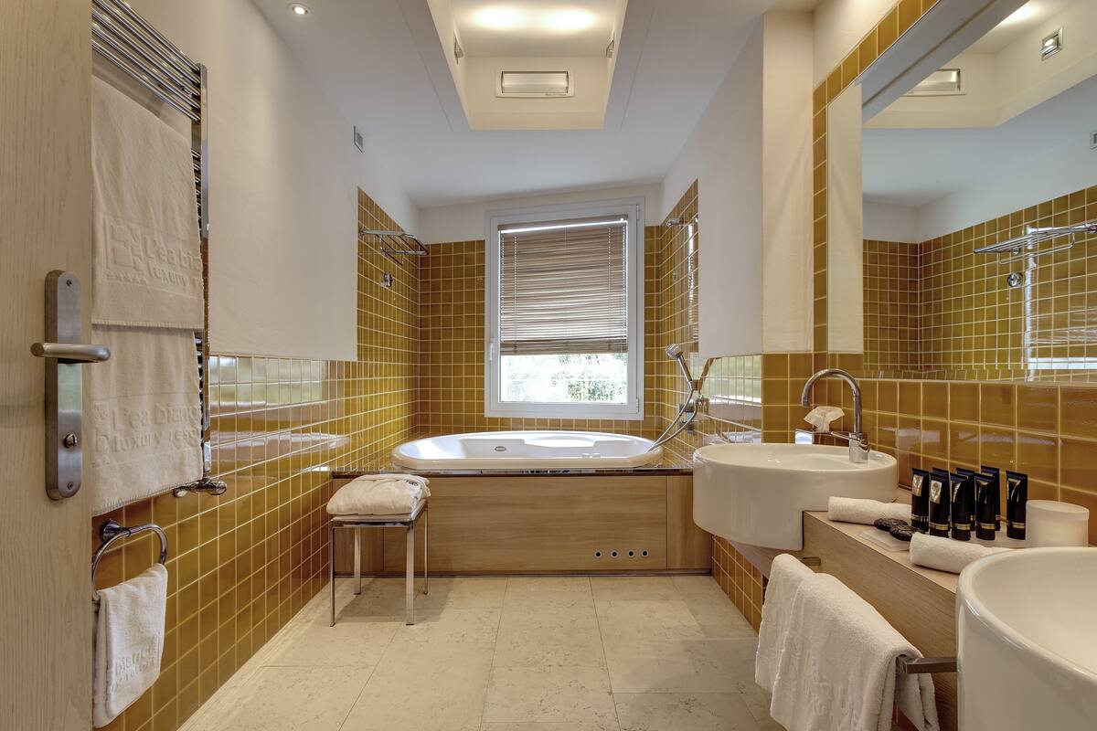 junior suite, 1 king bed with sofa bed, balcony, sea view | bathroom | free toiletries, hair dryer, bathrobes, slippers