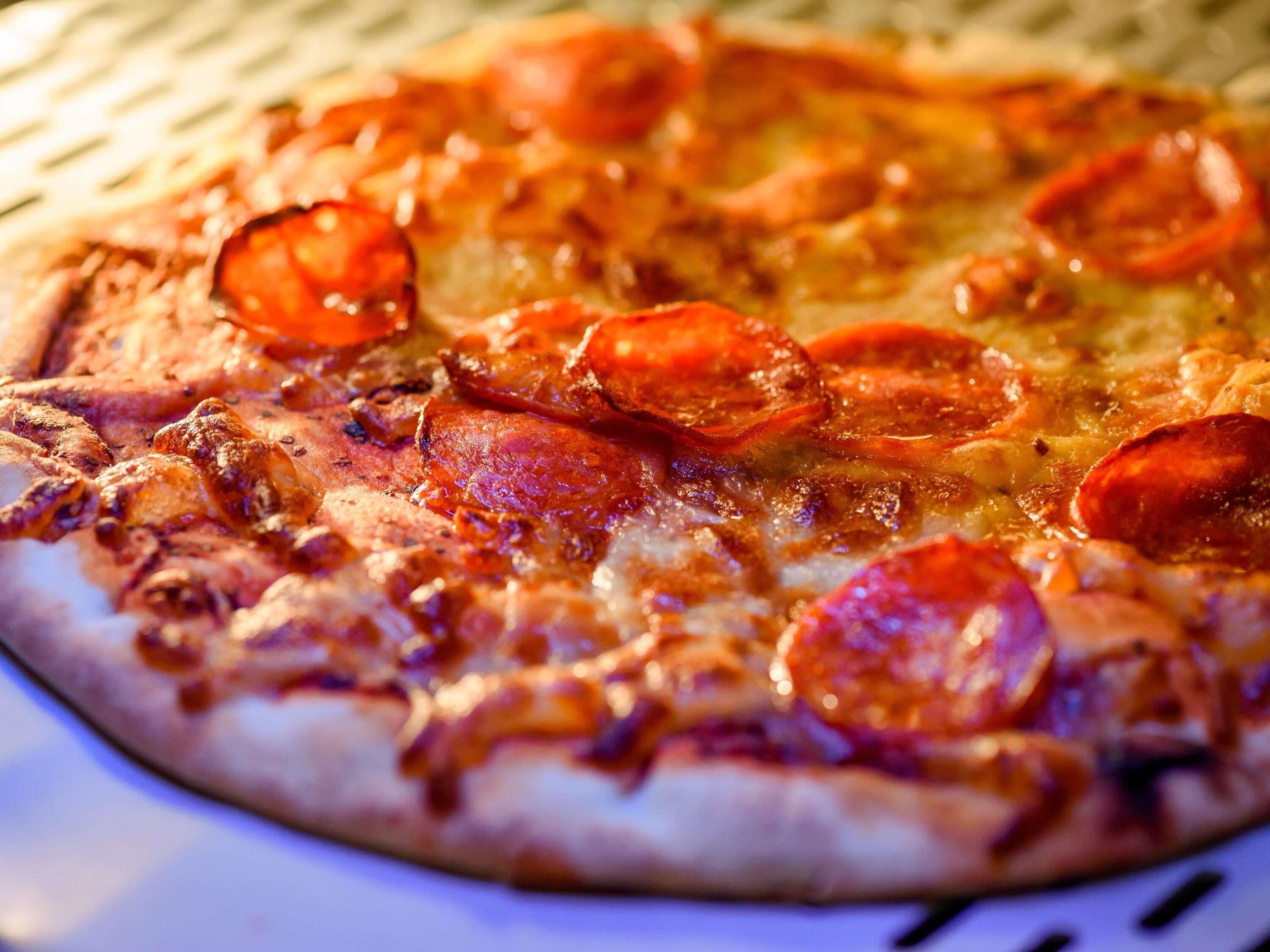 A pizza with pepperoni and cheese.