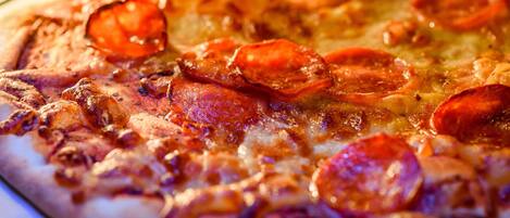 A pizza with pepperoni and cheese.