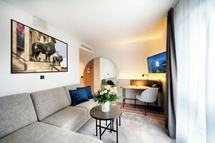 Suite, City View | Living area | 40-inch flat-screen TV with digital channels, TV