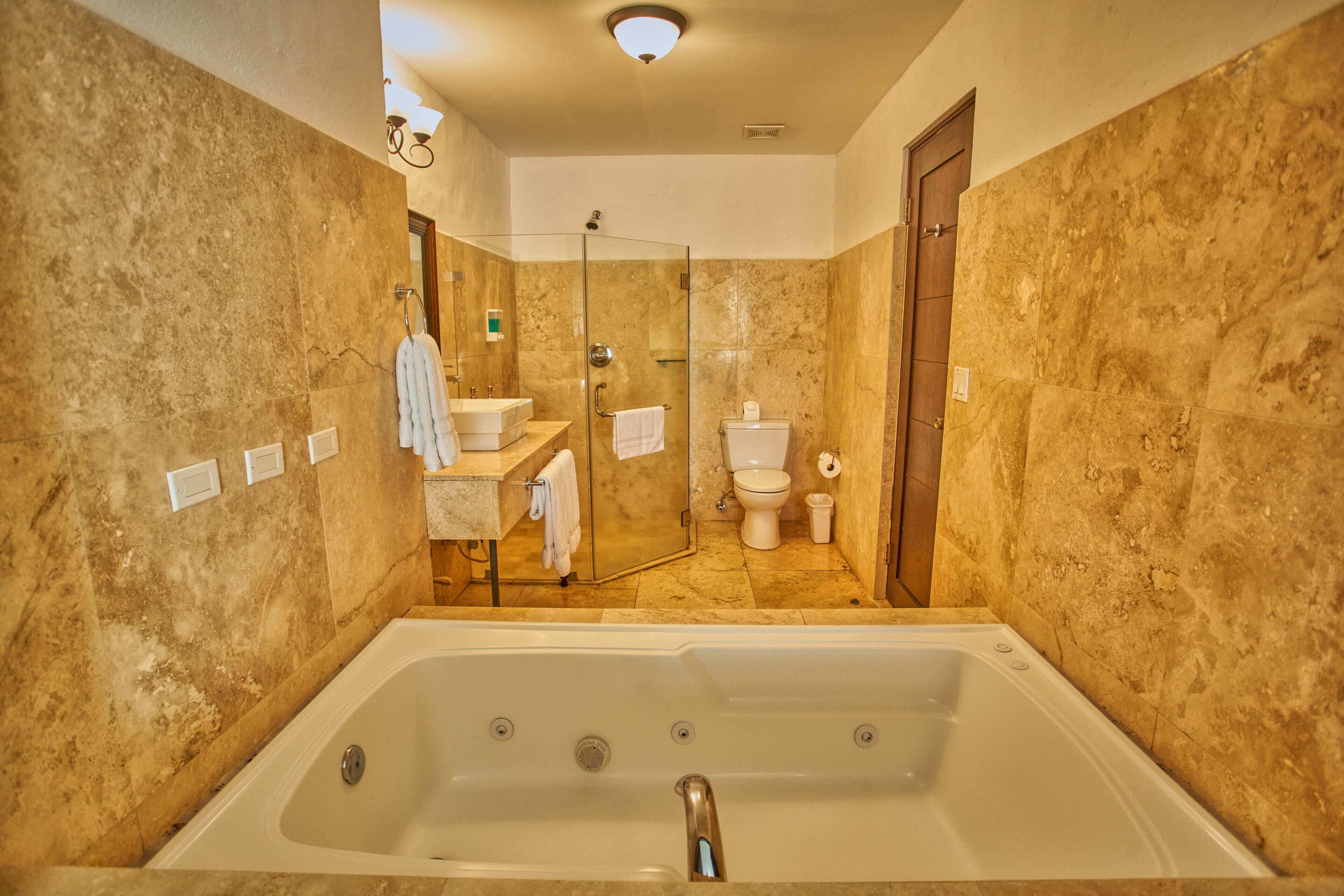 junior suite 1 king bed | bathroom | hair dryer, bathrobes, towels