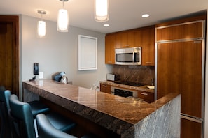 Fridge, microwave, coffee/tea maker, cookware/dishes/utensils