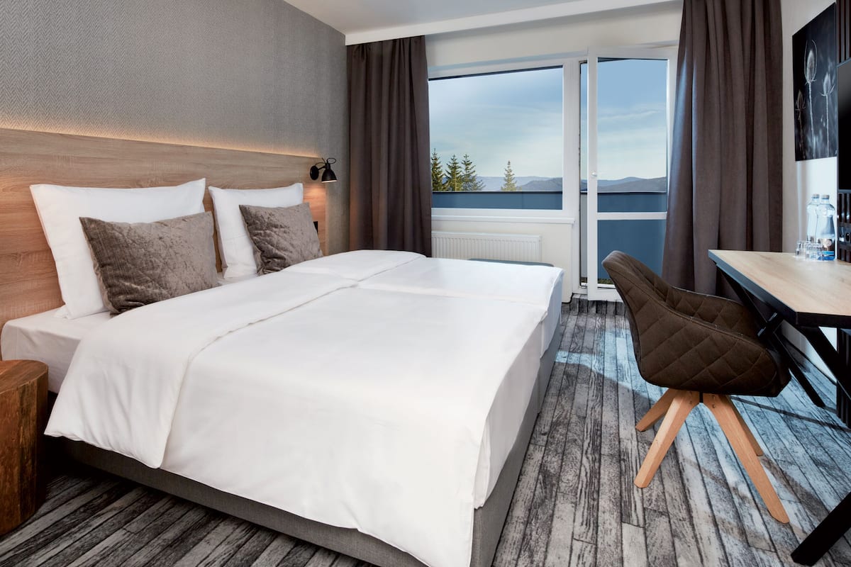 executive double room, balcony (plus) | desk, blackout curtains, iron/ironing board, free wifi