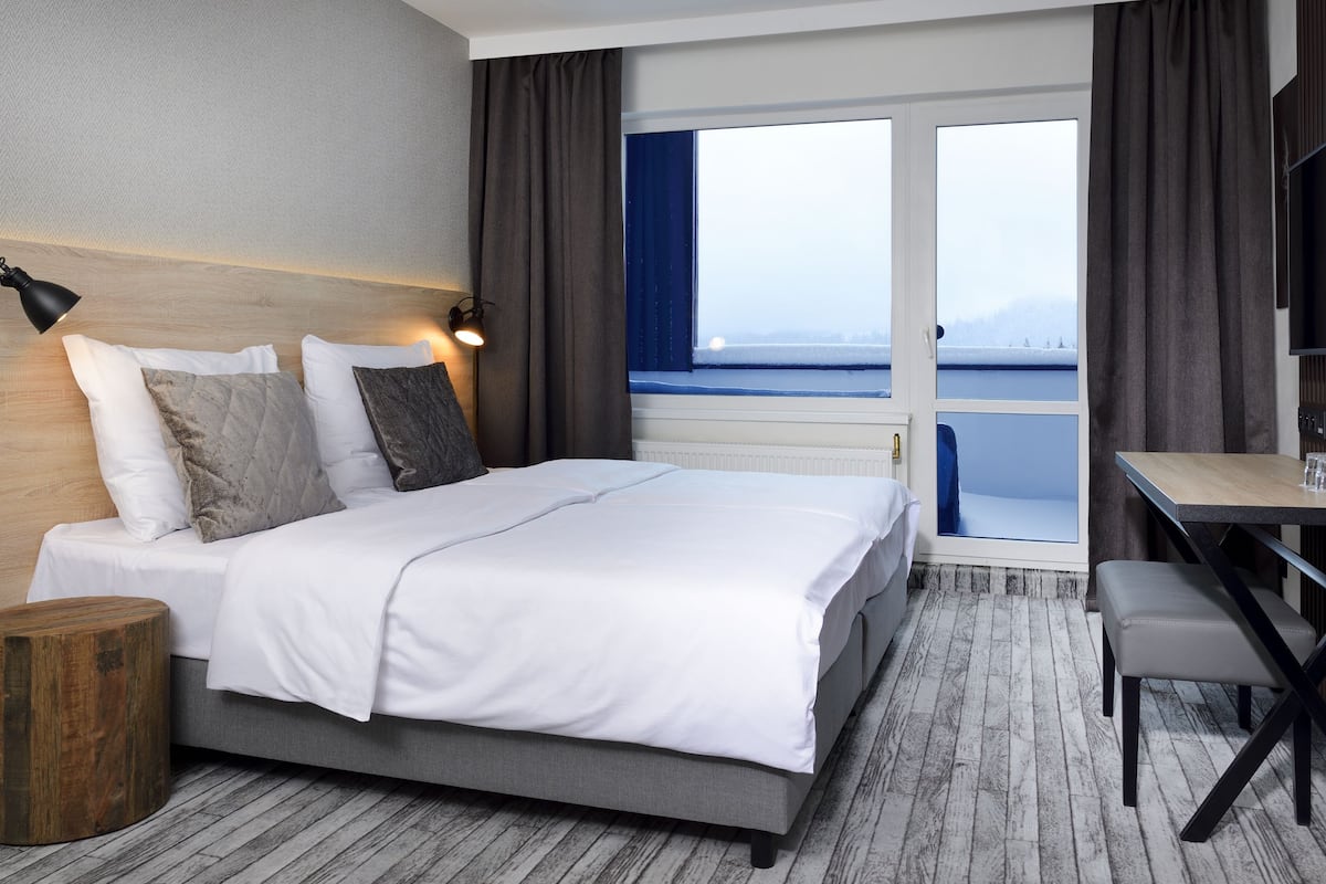 executive double room, balcony (plus) | desk, blackout curtains, iron/ironing board, free wifi