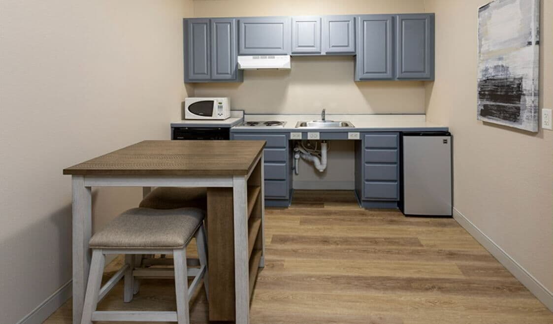 full-sized fridge, microwave, stovetop, dishwasher