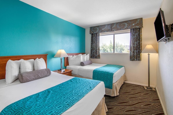 Pillowtop beds, desk, blackout drapes, iron/ironing board