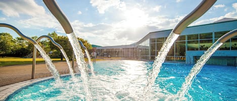 Indoor pool, outdoor pool, open 10 AM to 10 PM, pool loungers