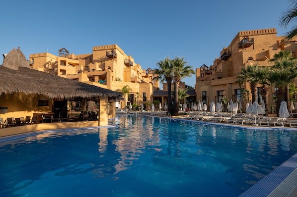 Indoor pool, pool umbrellas, pool loungers