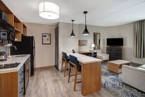 Premium bedding, desk, laptop workspace, blackout drapes