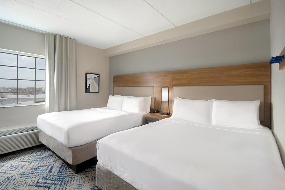 Premium bedding, desk, laptop workspace, blackout curtains