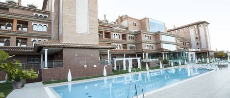 Seasonal outdoor pool, open 11:00 AM to 8:30 PM, pool umbrellas