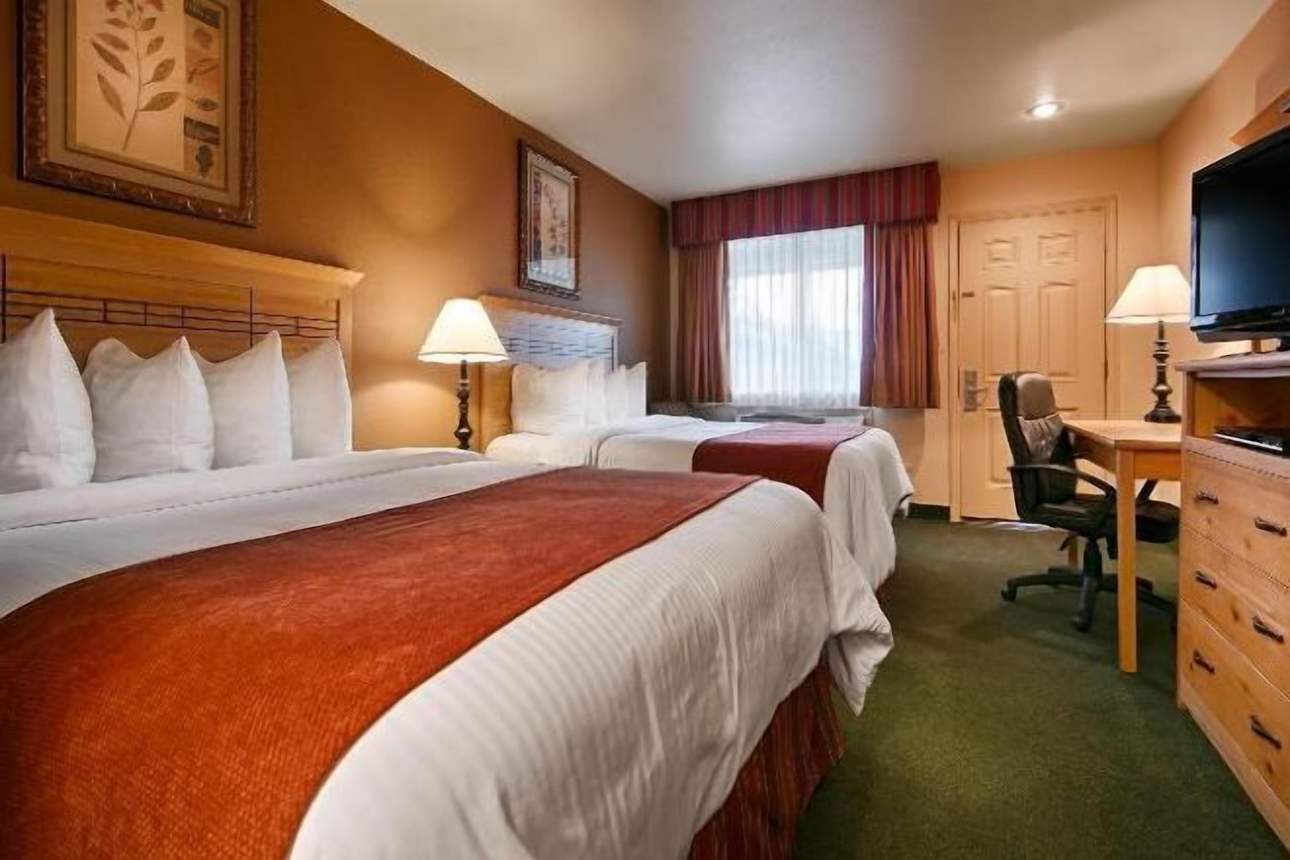 Down duvets, pillow-top beds, in-room safe, desk