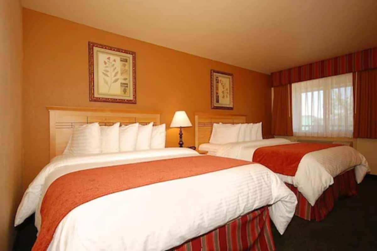 down duvets, pillow-top beds, in-room safe, desk