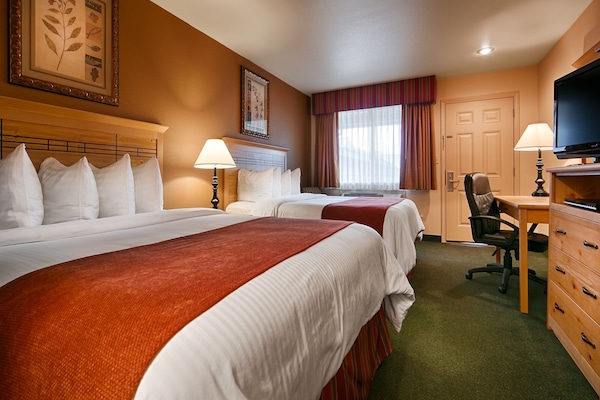 Down comforters, pillowtop beds, in-room safe, desk