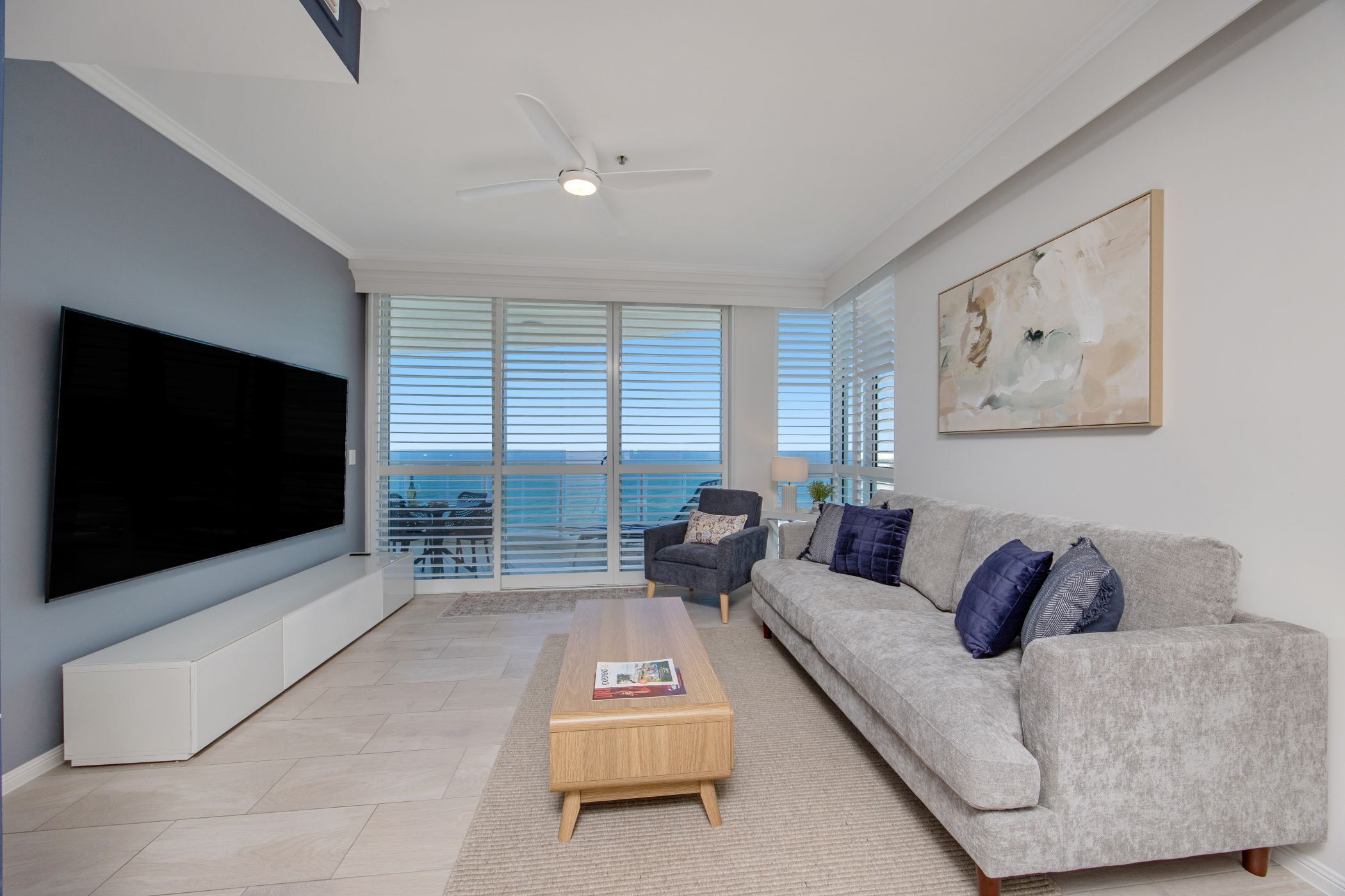 two bedroom ocean view - double beds | living area | tv