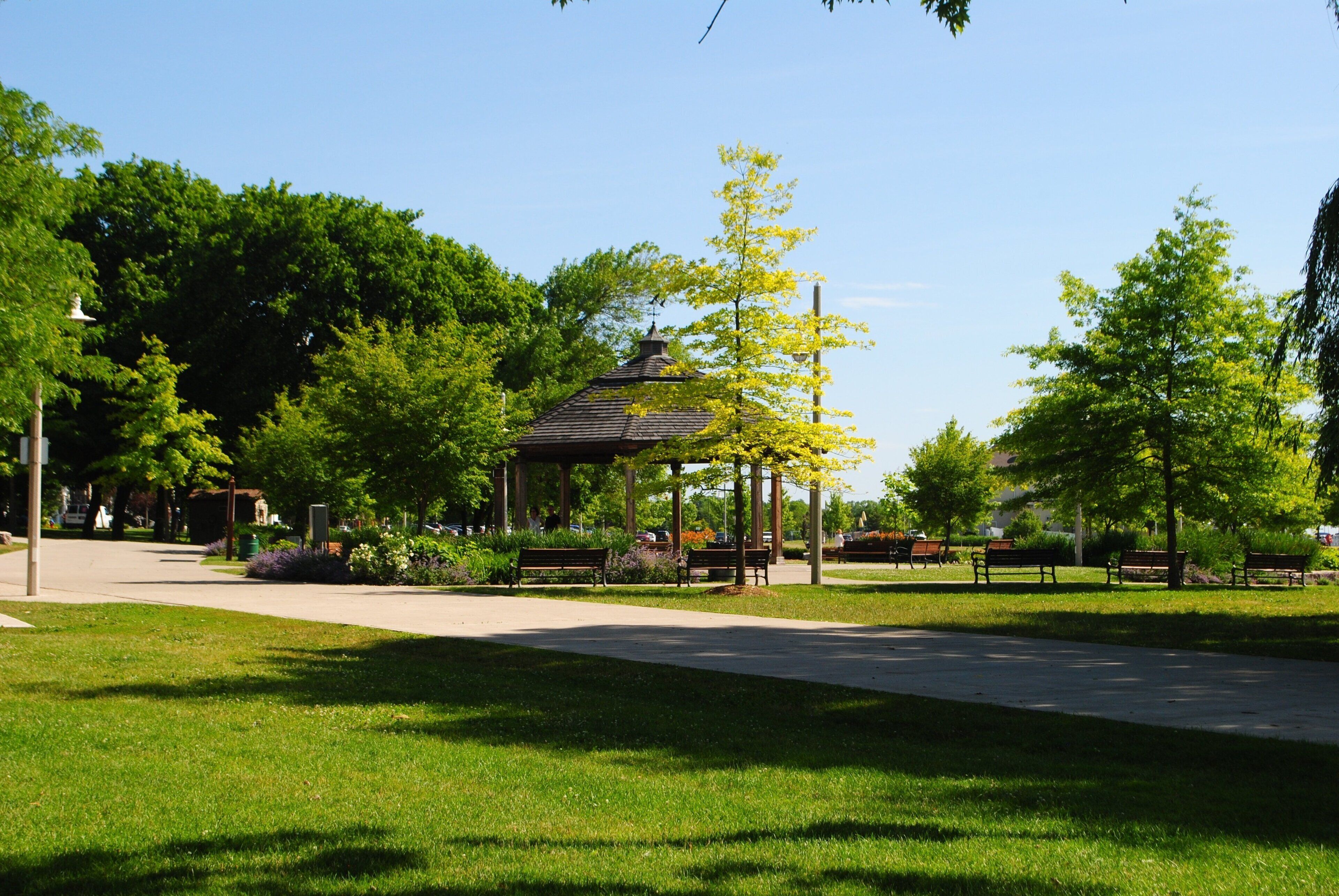 A park with a gazebo, benches, and a pathway.