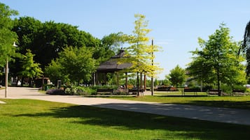 A park with a gazebo, benches, and a pathway.