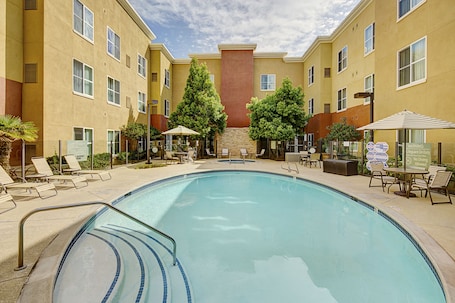 Outdoor pool, sun loungers. Homewood Suites by Hilton Carlsbad-North San Diego County