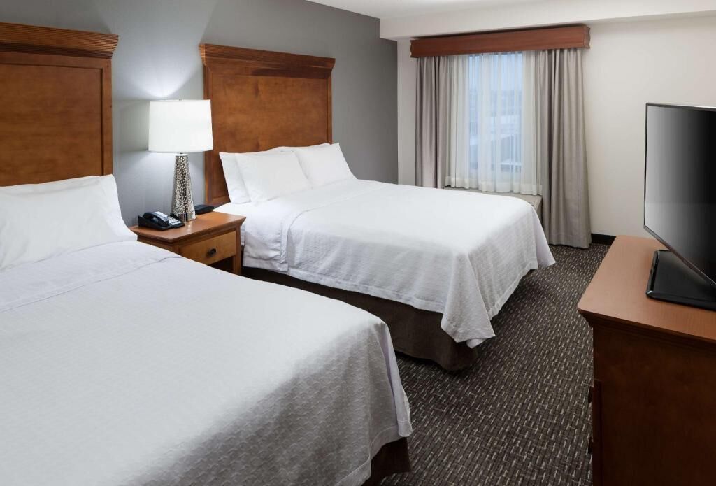 Premium bedding, blackout drapes, iron/ironing board