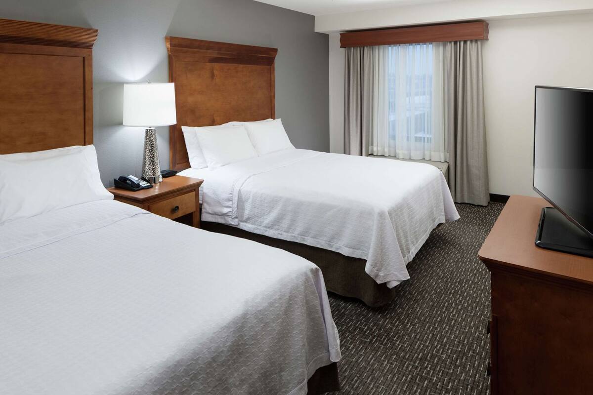 Premium bedding, blackout drapes, iron/ironing board