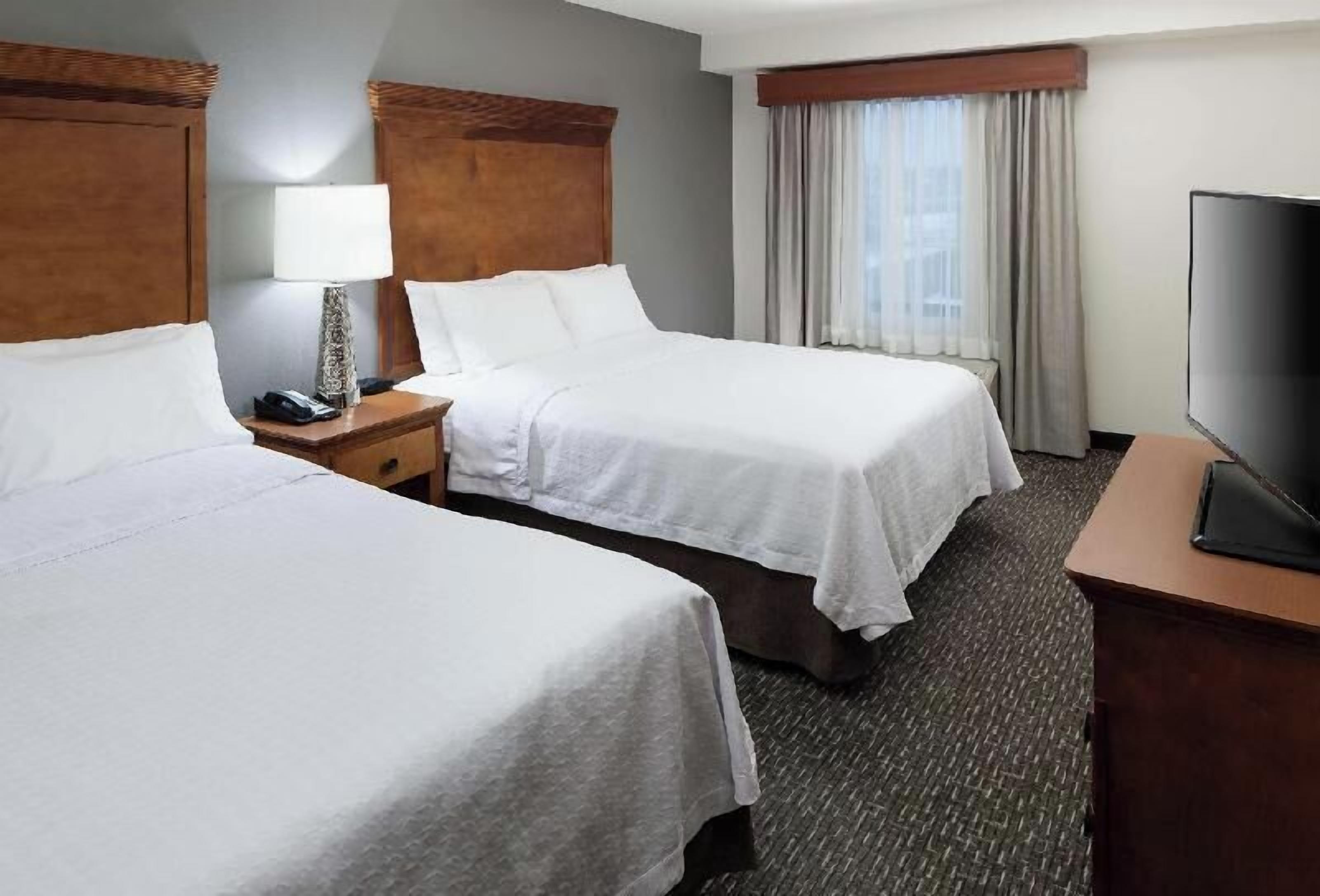 Premium bedding, blackout drapes, iron/ironing board
