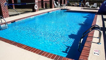 Seasonal outdoor pool, pool loungers