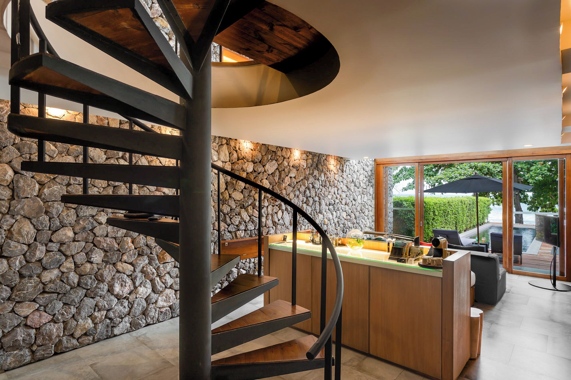 luxury oceanfront pool villa | living area | 32-inch lcd tv with satellite channels, tv, dvd player