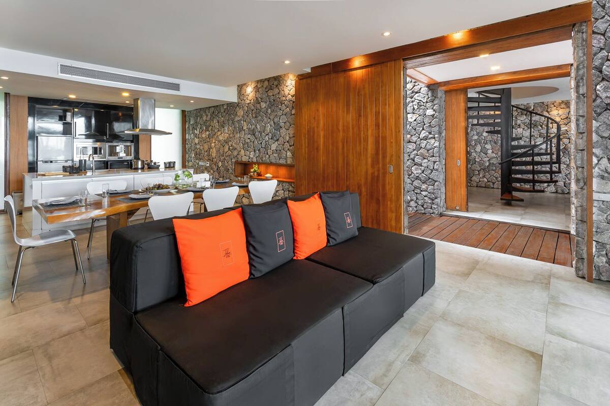 royal oceanfront pool villa | living area | 32-inch lcd tv with satellite channels, tv, dvd player