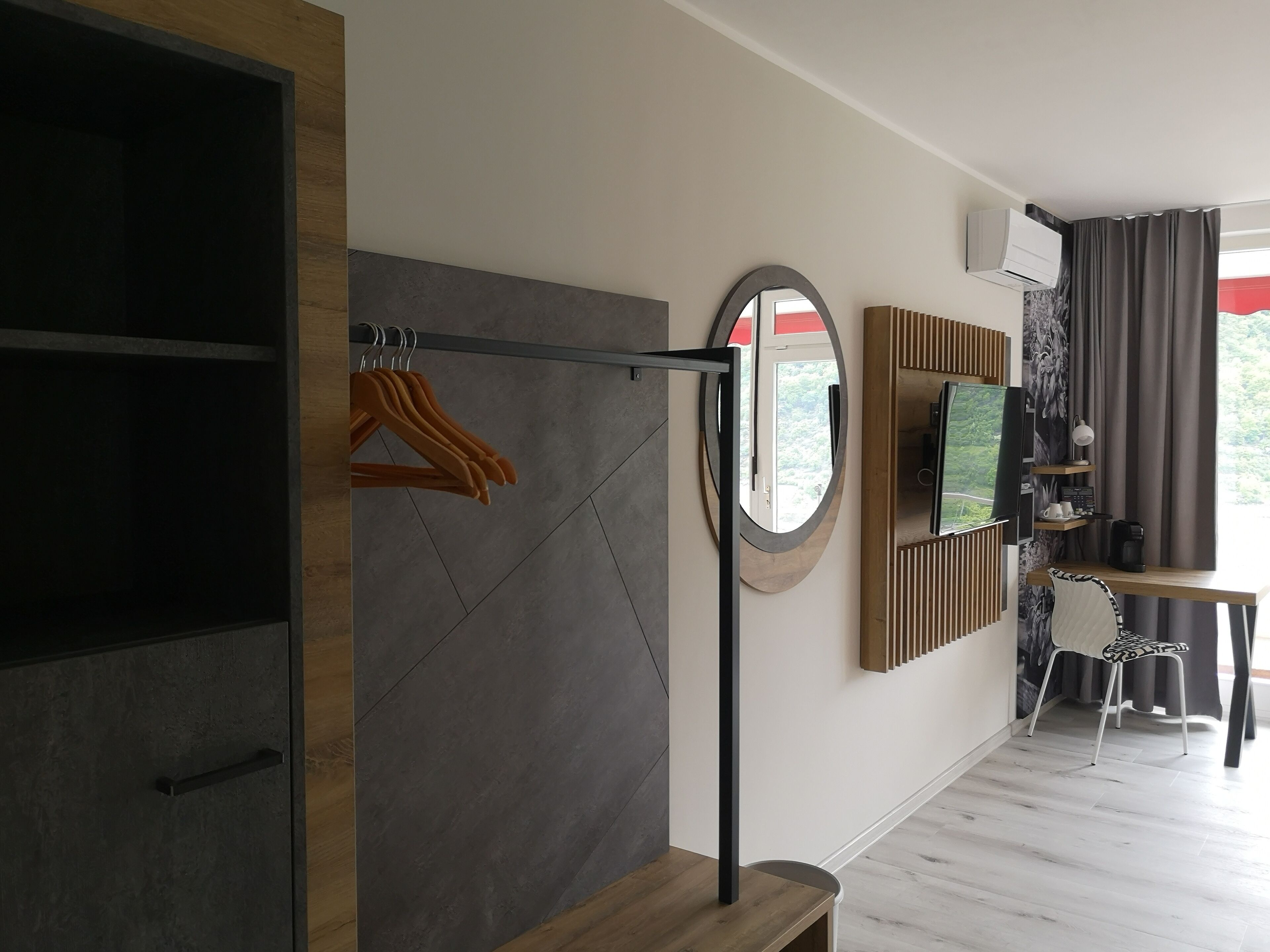 deluxe double room, balcony, river view | living area | 40-inch smart tv with digital channels, tv, netflix