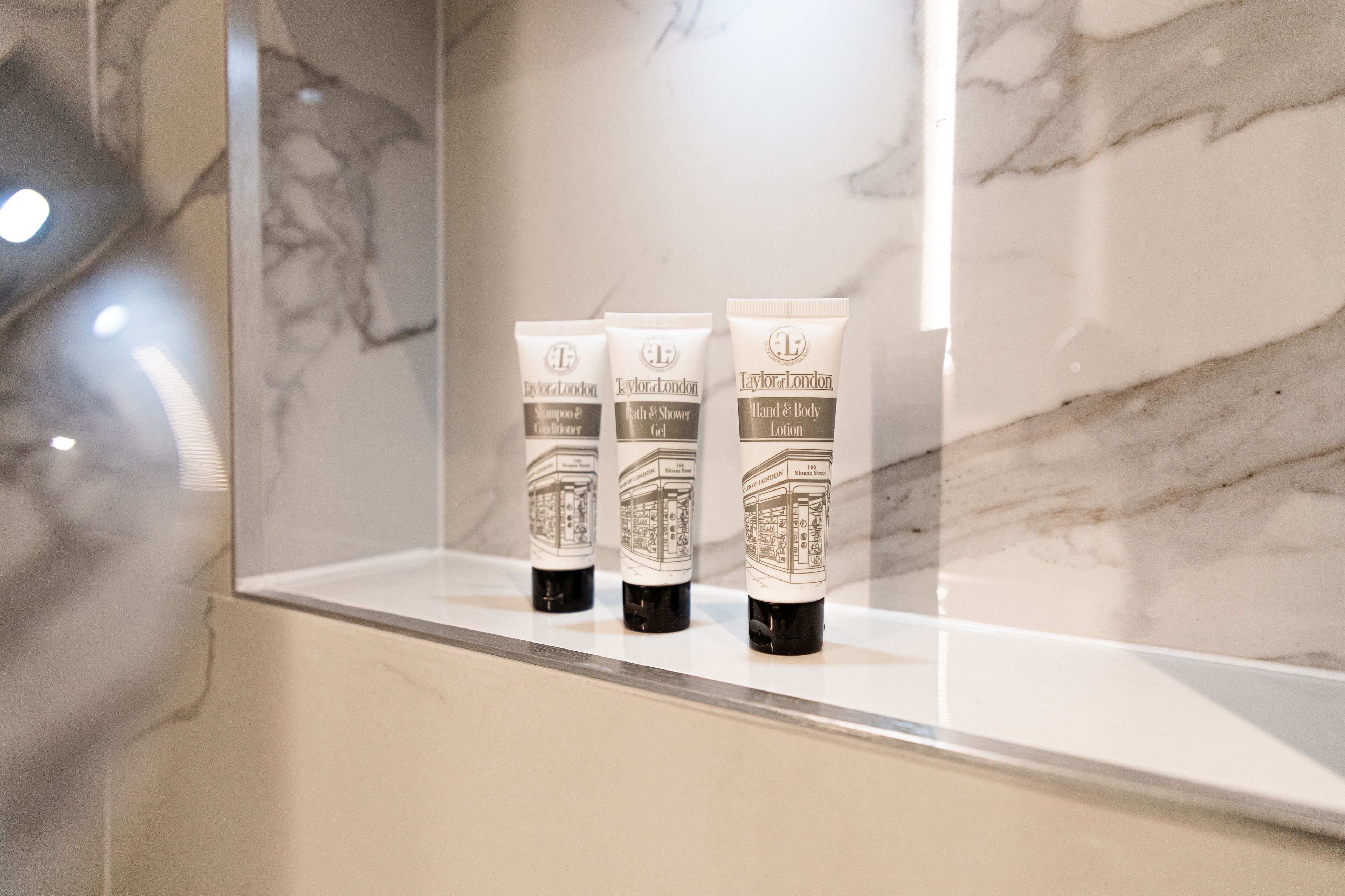 hair dryer, towels, soap, shampoo