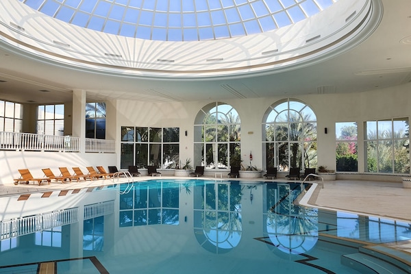 Indoor pool, outdoor pool, open 10:00 AM to 6:00 PM, pool umbrellas