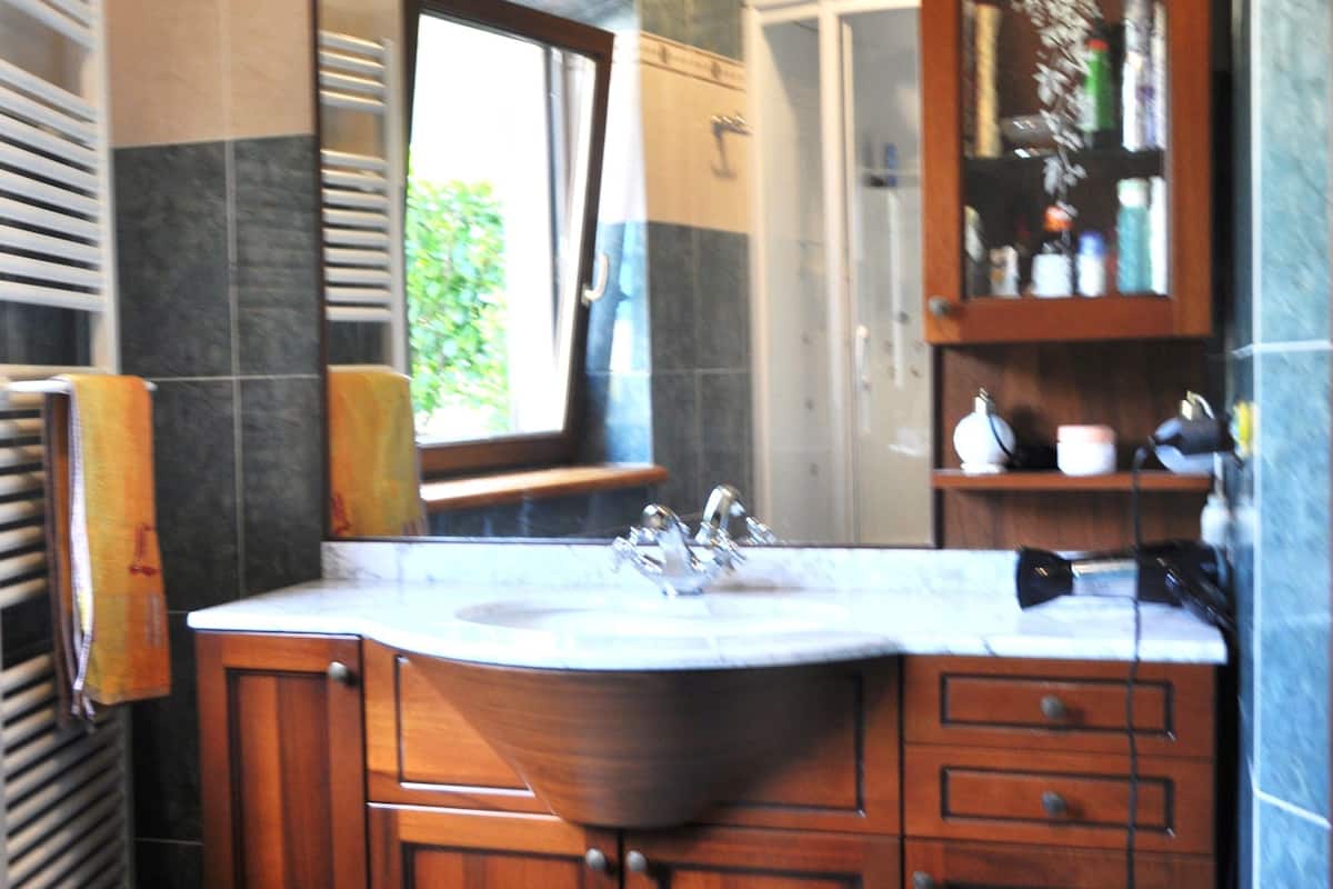 shower, rainfall showerhead, designer toiletries, hair dryer