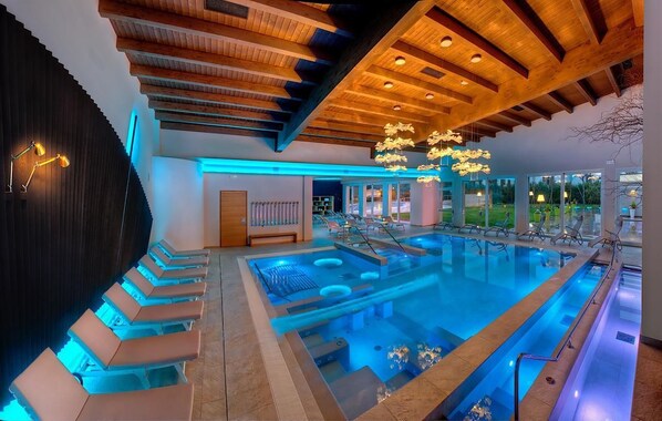 Indoor pool, outdoor pool, pool umbrellas, pool loungers
