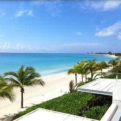 On the beach, white sand, sun-loungers, beach umbrellas