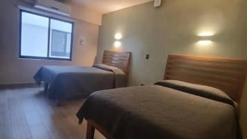 Standard Room, 2 Double Beds | In-room safe, individually decorated, individually furnished, desk