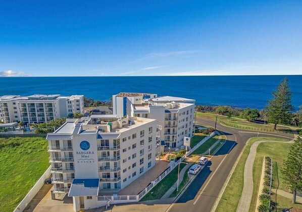 A multi-story building with a sign reading 'BARGARA BLUE RESORT.'
