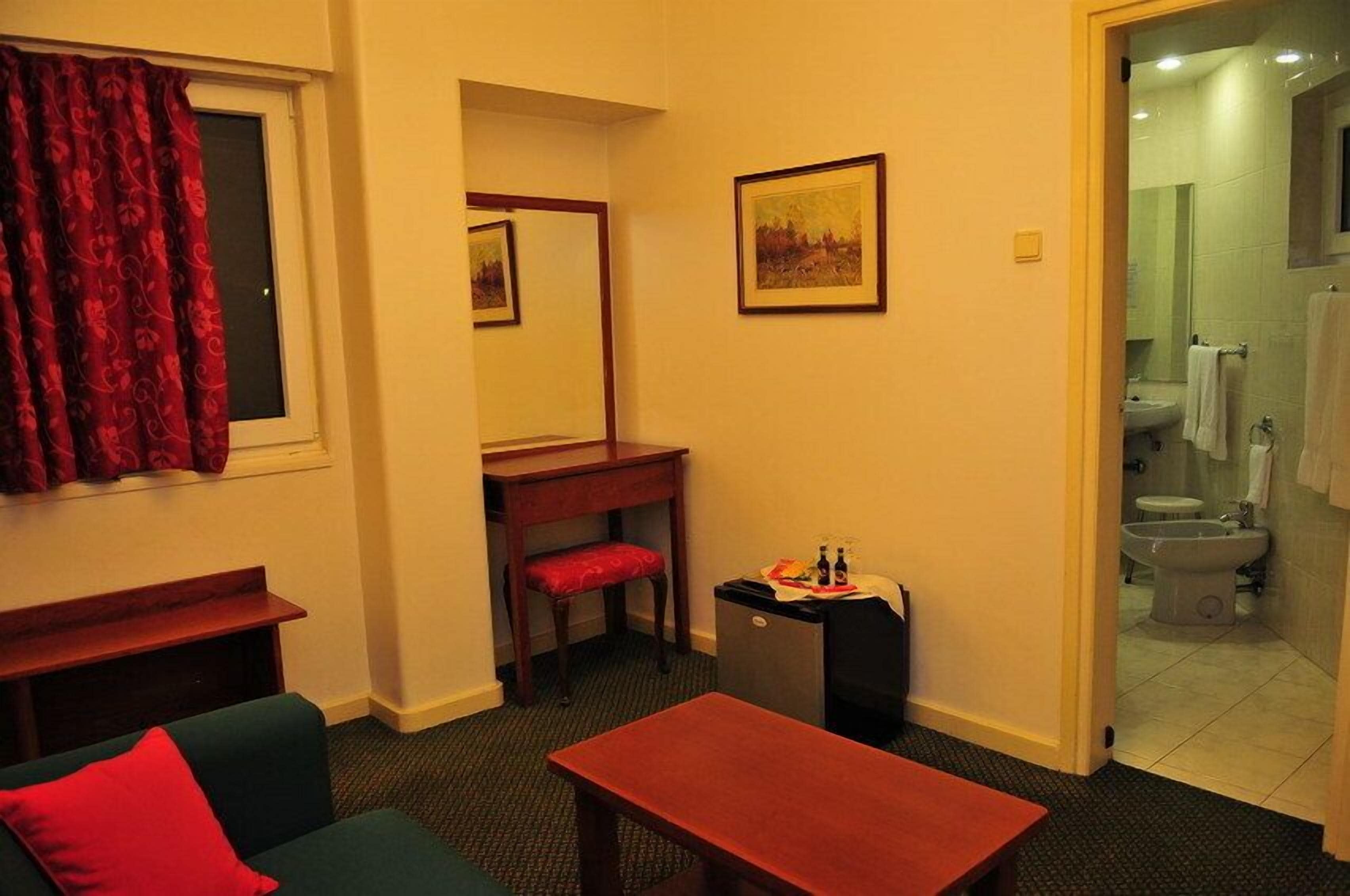 Suite, 1 King Bed | Living area | TV