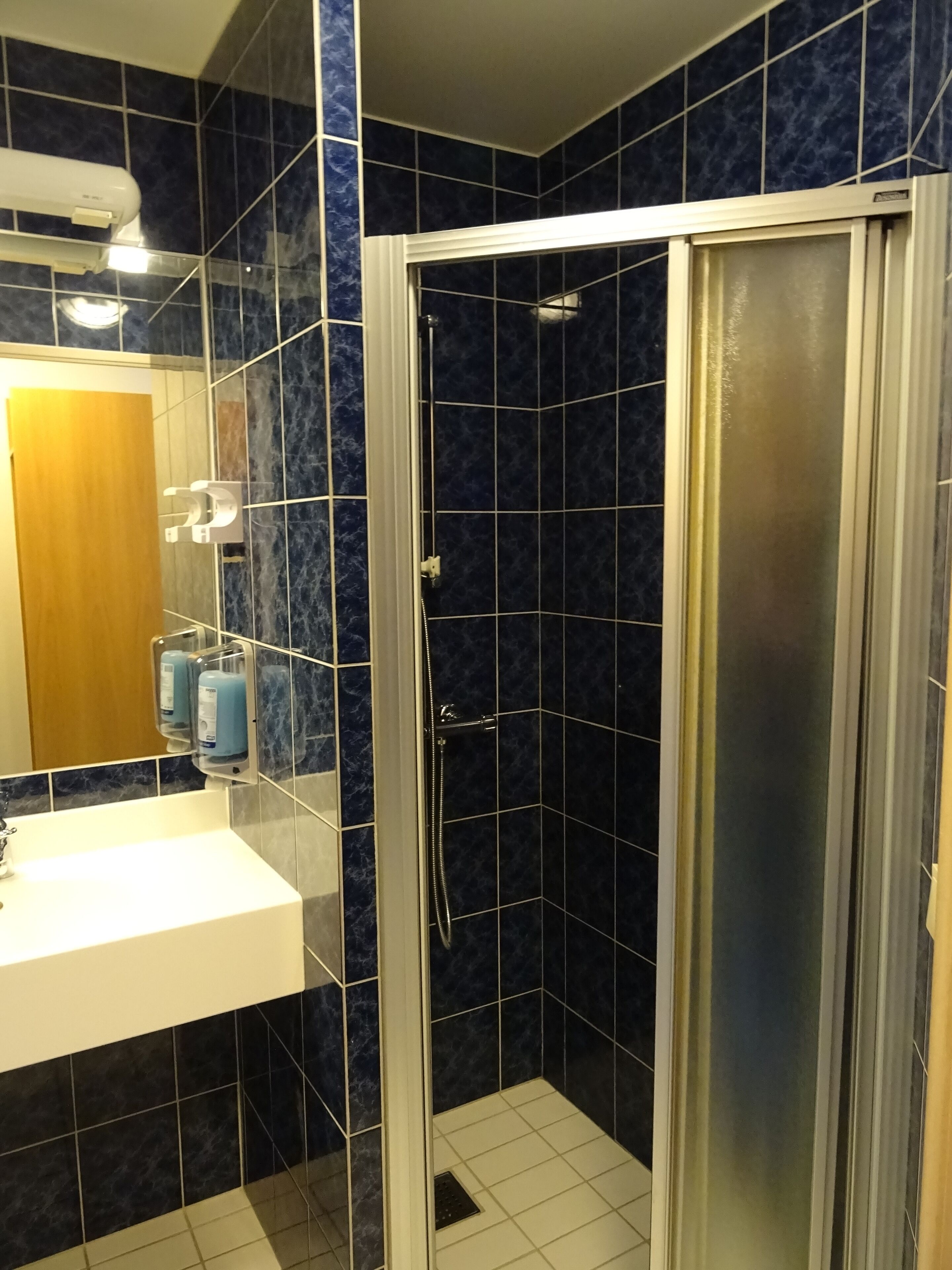 shower, hair dryer, heated floors, towels