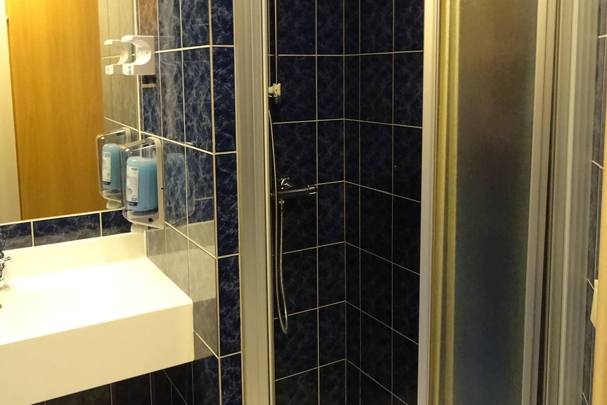 shower, hair dryer, heated floors, towels