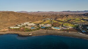 On the beach, black sand, beach towels, scuba diving