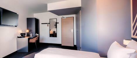 Een bureau, geluiddichte muren, gratis wifi, beddengoed