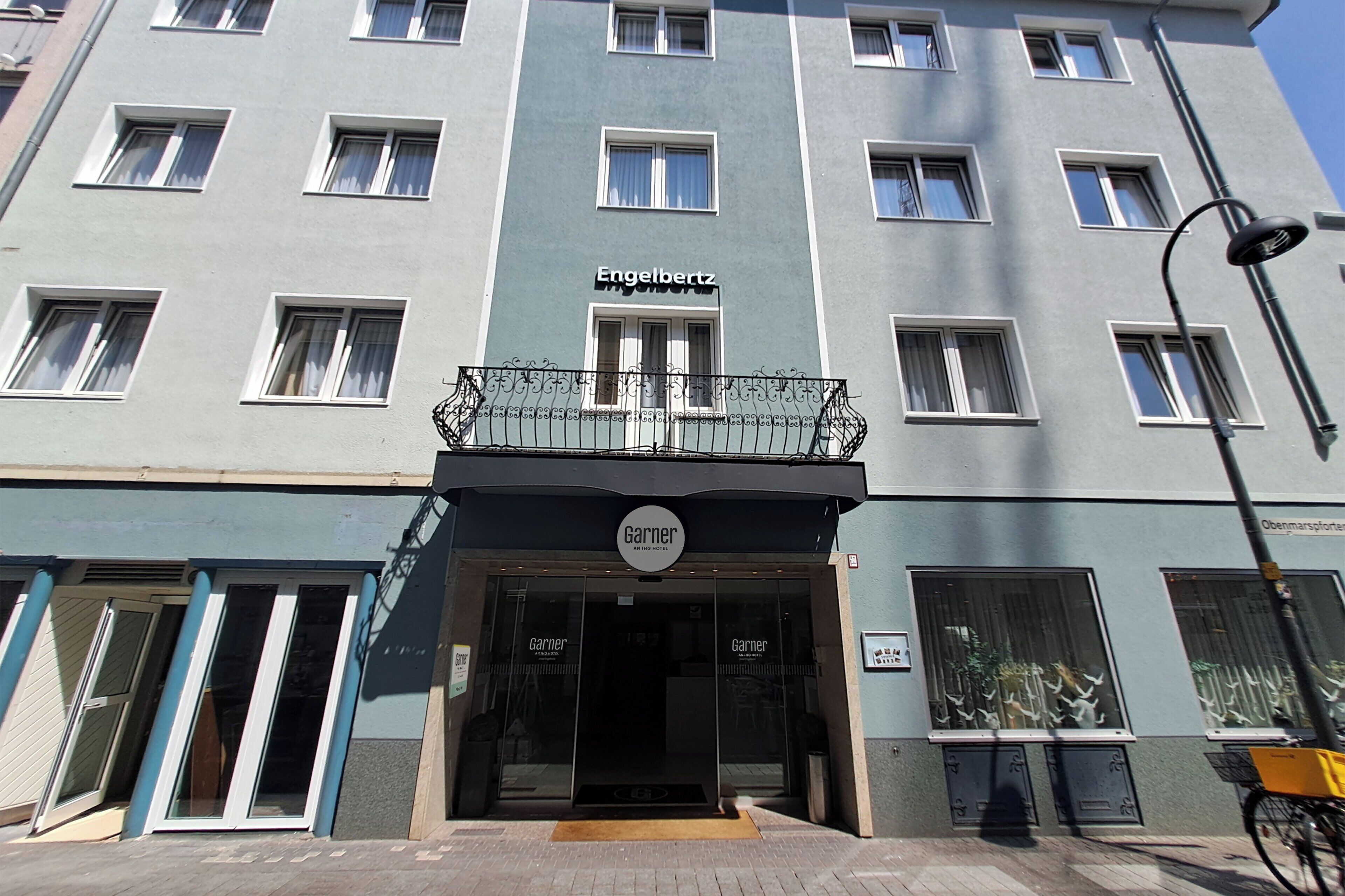 A hotel entrance with a sign reading "Engelbertz" and "Garner."