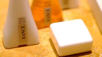 Several bottles of skincare products with labels, arranged on a surface.