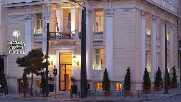 A hotel with a classical facade, columns, and a sign for the Acropolis Museum Hotel. - Acropolis Museum Boutique Hotel (Athens)