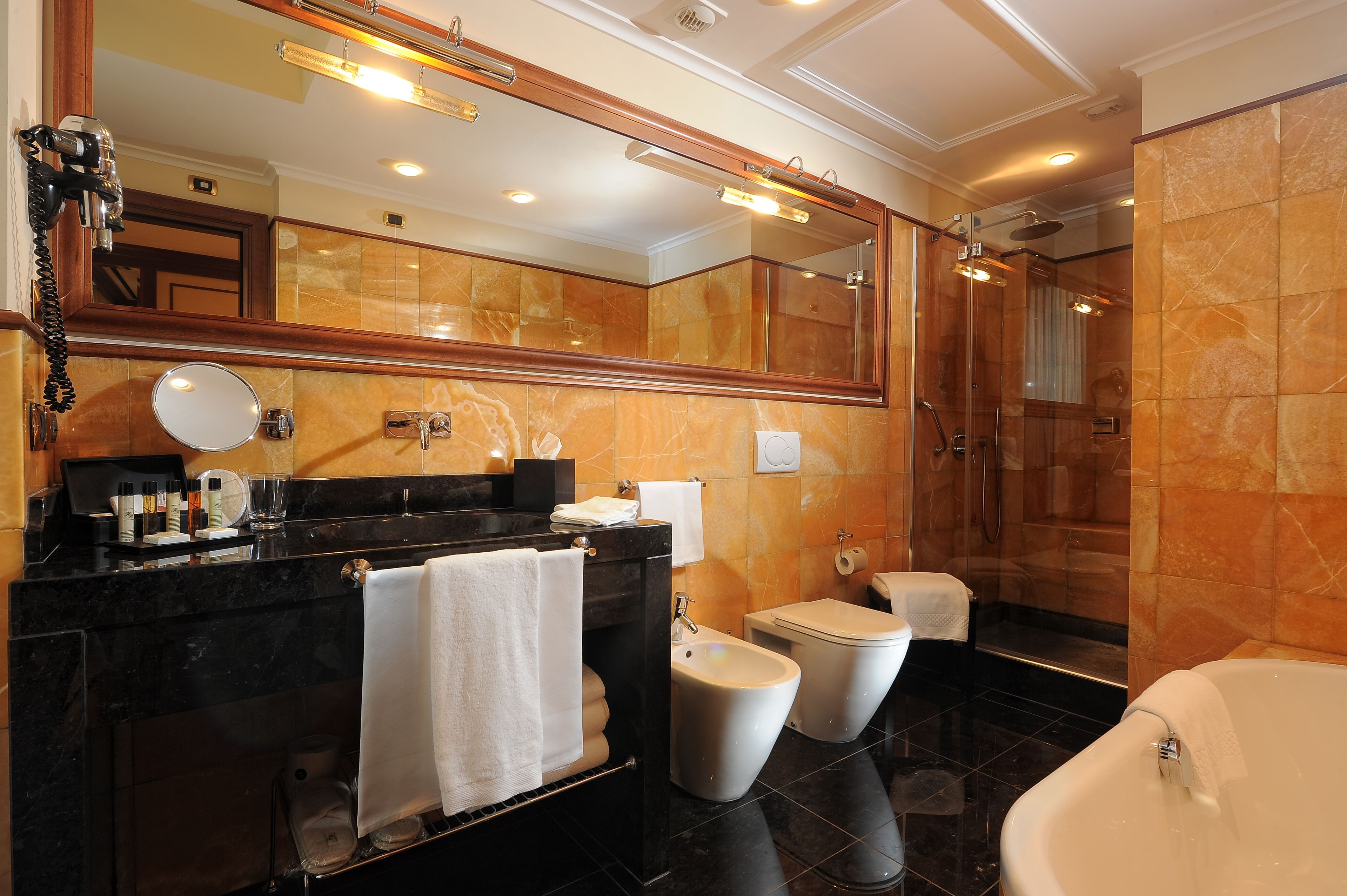 deluxe room | bathroom | free toiletries, hair dryer, slippers, bidet
