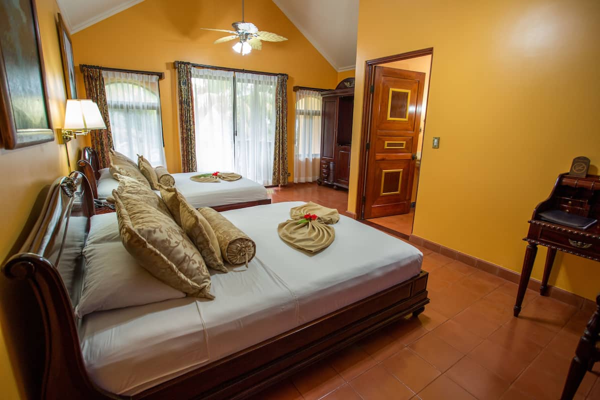 deluxe double room, 2 queen beds | down duvets, in-room safe, desk, free cots/infant beds