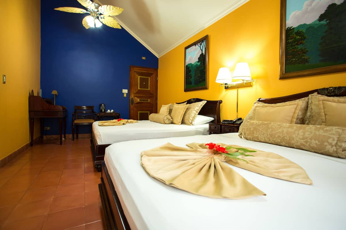 deluxe double room, 2 queen beds | down duvets, in-room safe, desk, free cots/infant beds