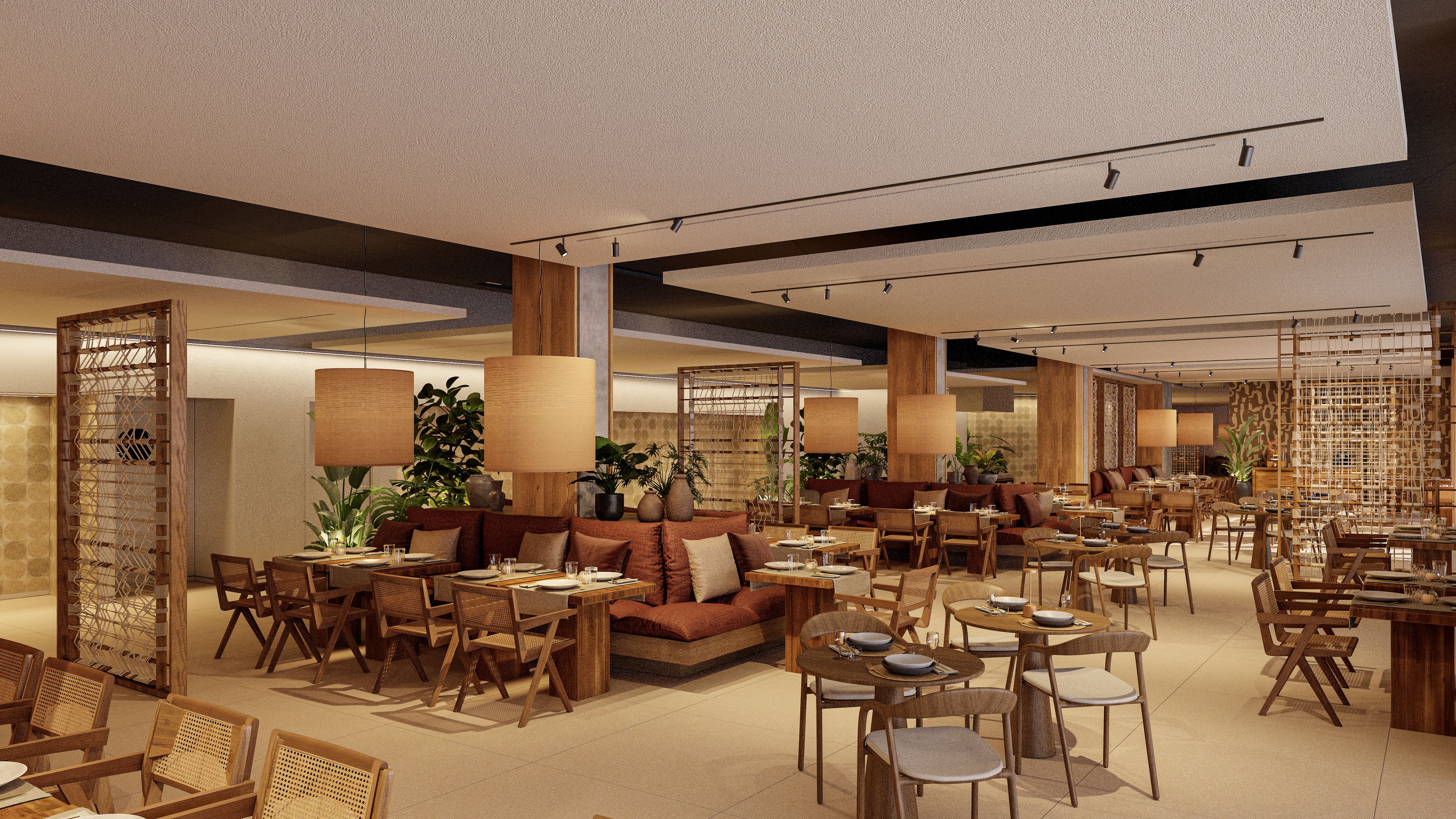 A spacious restaurant with multiple seating areas, including tables and sofas, and a variety of plants adding greenery.